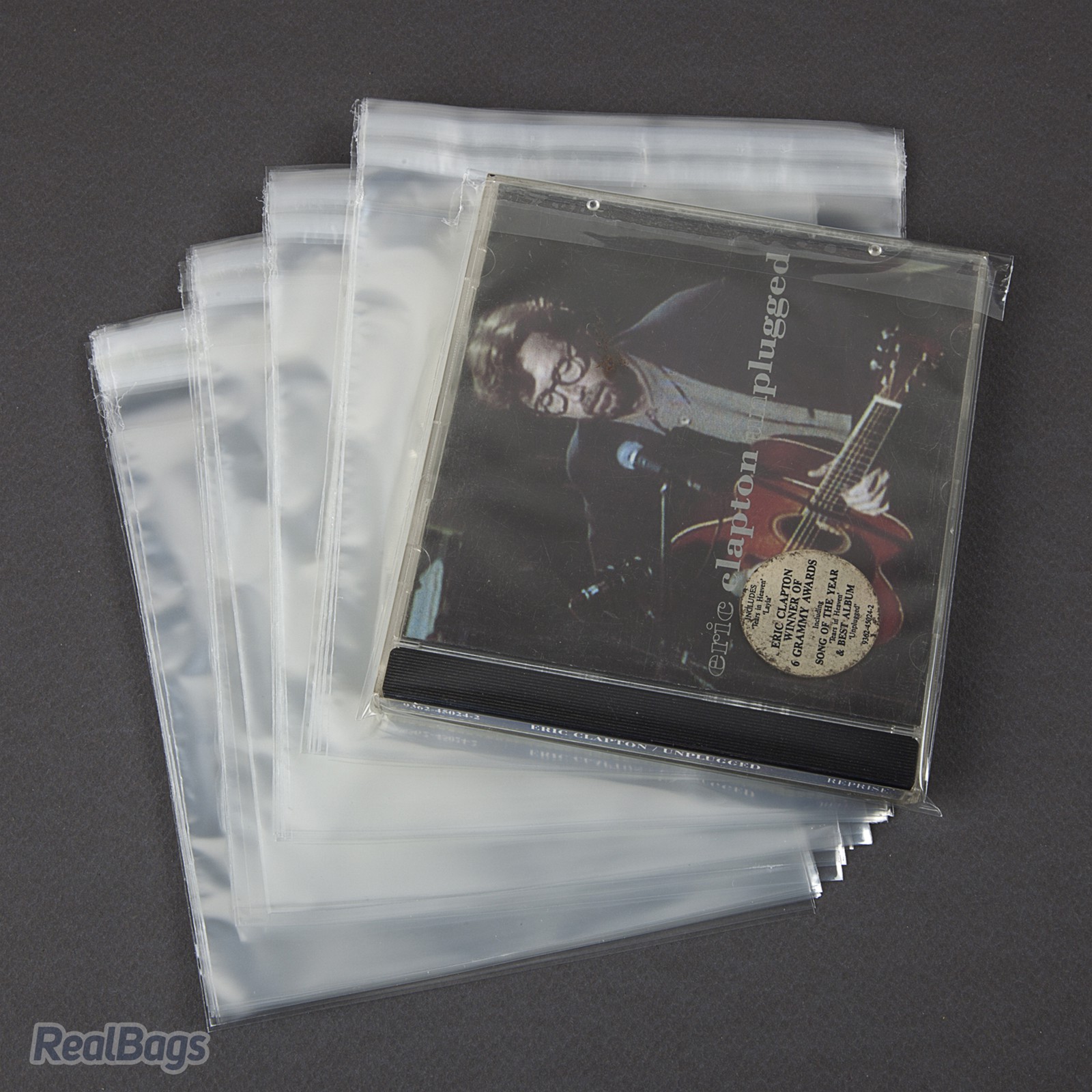 100 Buste per CD con custodia in polipropilene trasparente lucido con  chiusura adesiva 38my micron – Buste per Vinili, Fumetti e CD/DVD